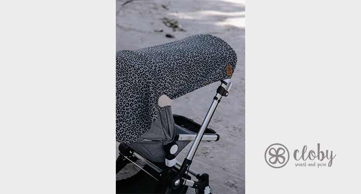Grau schwarz gemusterte Decke auf Kinderwagen mit Magnetclip von cloby