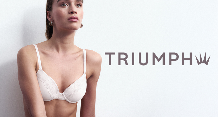 Frau in weißem BH und Slip von Triumph